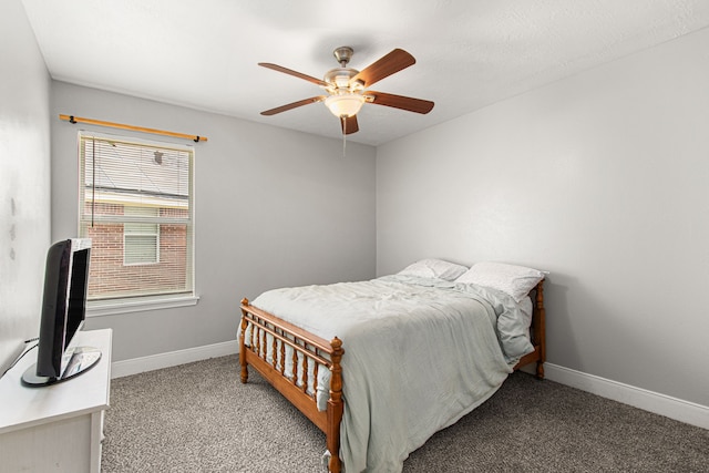 bedroom featuring a ceiling fan, baseboards, and carpet