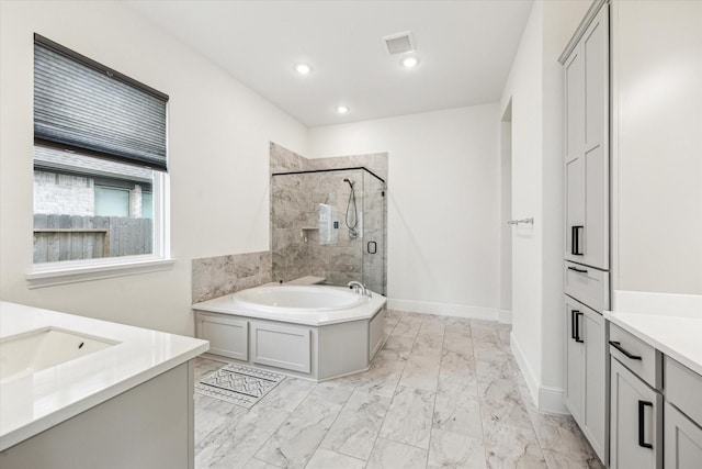 bathroom featuring vanity, a garden tub, marble finish floor, visible vents, and a stall shower