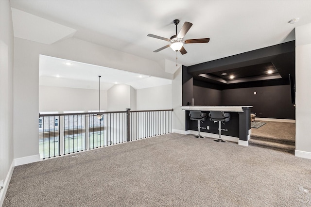 carpeted spare room featuring a ceiling fan, baseboards, and recessed lighting