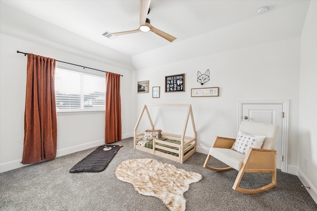 interior space with baseboards, a ceiling fan, carpet flooring, and visible vents