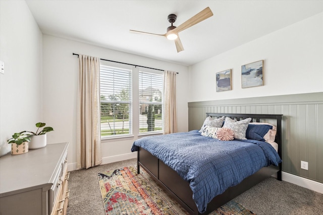 bedroom featuring baseboards, ceiling fan, and light colored carpet