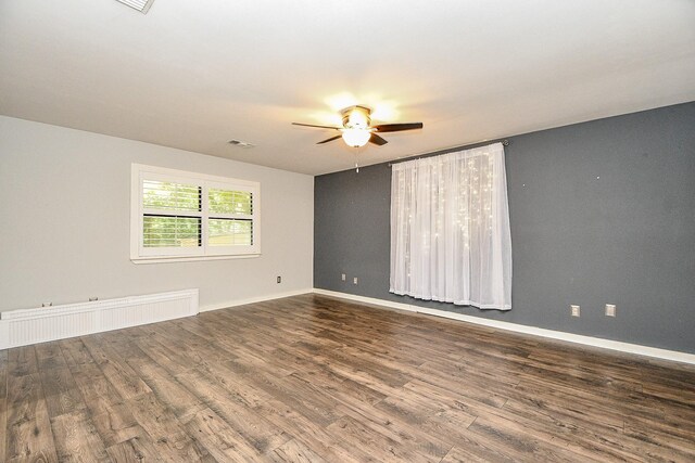 406 Hidden Creek Cir, Sealy, TX 77474 - empty room with wood finished floors, ceiling fan, and baseboards