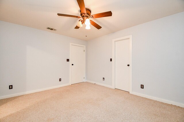 406 Hidden Creek Cir, Sealy, TX 77474 - spare room featuring light carpet, a ceiling fan, and baseboards