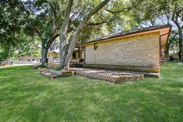 406 Hidden Creek Cir, Sealy, TX 77474 - rear view of property featuring brick siding and central air condition unit