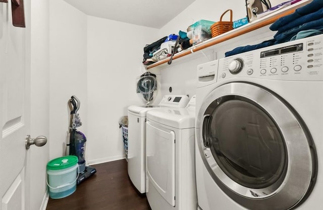 1942 Macondray Dr, Humble, TX 77396 - laundry area featuring laundry area, baseboards, dark wood-type flooring, and washing machine and clothes dryer