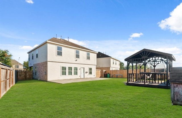 1942 Macondray Dr, Humble, TX 77396 - back of property featuring a gazebo, a fenced backyard, a lawn, and a patio