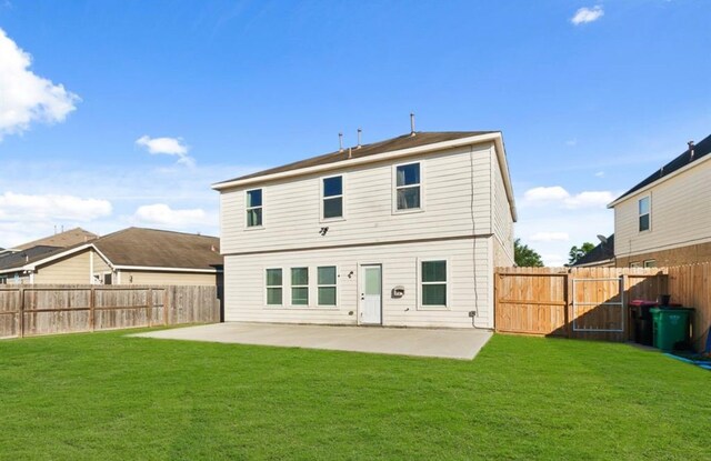 1942 Macondray Dr, Humble, TX 77396 - rear view of house with a lawn, a patio, and a fenced backyard