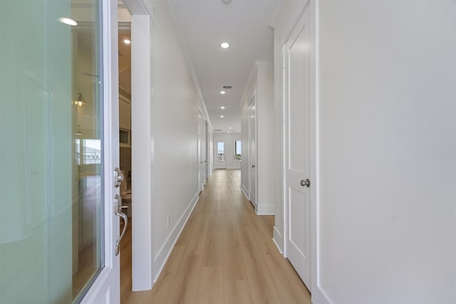 4042 Miramar Ct, Galveston, TX 77554 - hallway featuring light wood-style floors, recessed lighting, baseboards, and crown molding