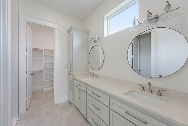 4042 Miramar Ct, Galveston, TX 77554 - full bathroom with double vanity, a spacious closet, and a sink