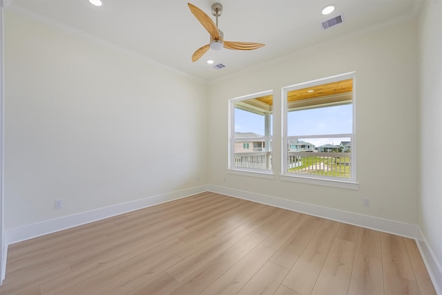 4042 Miramar Ct, Galveston, TX 77554 - unfurnished room featuring ornamental molding, light wood-type flooring, ceiling fan, and visible vents