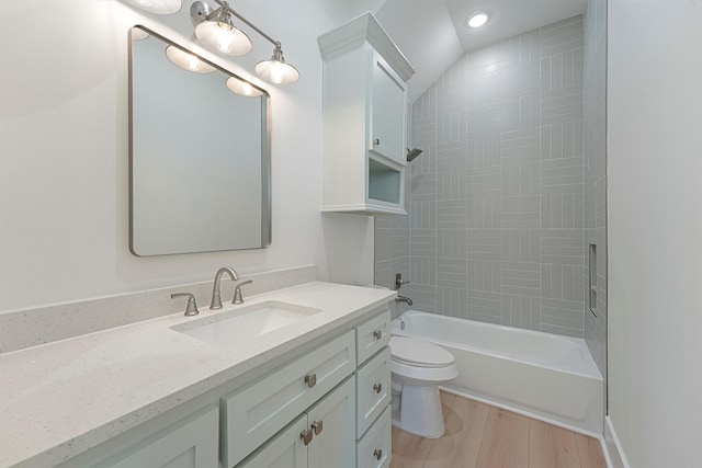 4042 Miramar Ct, Galveston, TX 77554 - bathroom featuring vanity, wood finished floors, toilet, recessed lighting, and shower / bath combination
