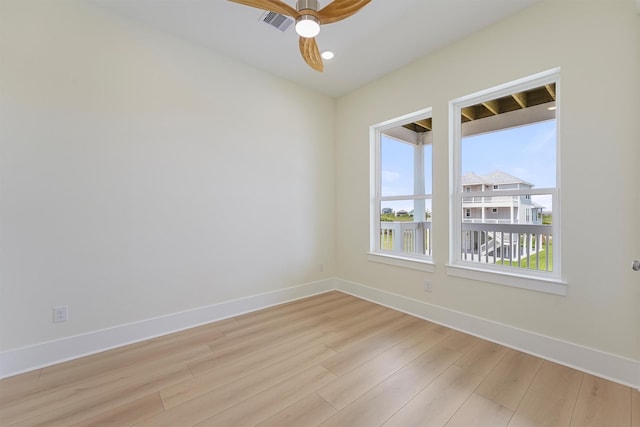 4042 Miramar Ct, Galveston, TX 77554 - unfurnished room featuring baseboards, light wood-style floors, ceiling fan, and visible vents