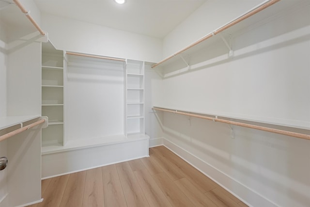 4042 Miramar Ct, Galveston, TX 77554 - walk in closet with wood finished floors