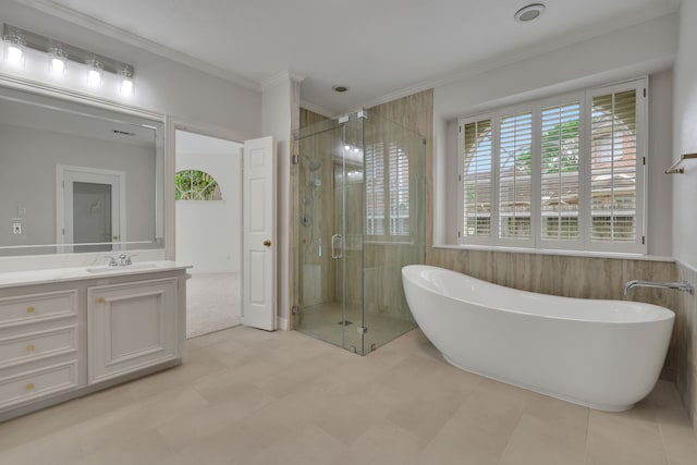 full bathroom with vanity, ornamental molding, a freestanding tub, and a shower stall