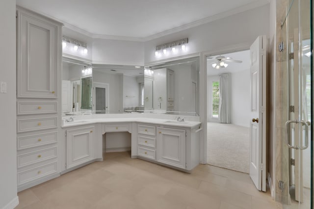 bathroom with double vanity, a sink, ceiling fan, and crown molding