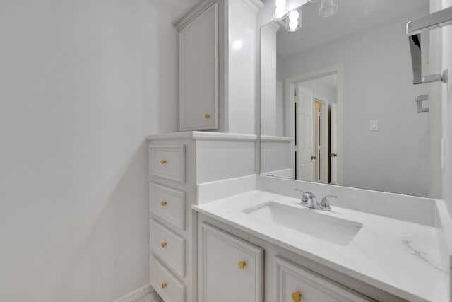bathroom featuring vanity and baseboards