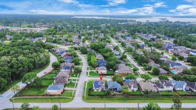 bird's eye view with a residential view and a water view