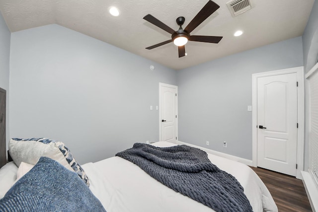bedroom featuring a ceiling fan, dark wood-style flooring, visible vents, vaulted ceiling, and recessed lighting