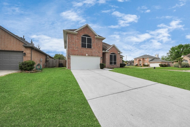 traditional-style home with a front lawn, fence, brick siding, an attached garage, and driveway