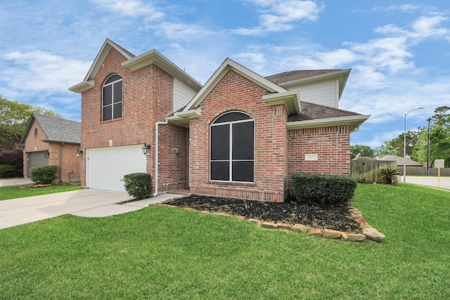traditional home with driveway, a front yard, a garage, brick siding, and fence