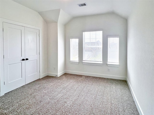 unfurnished bedroom with visible vents, baseboards, and carpet floors