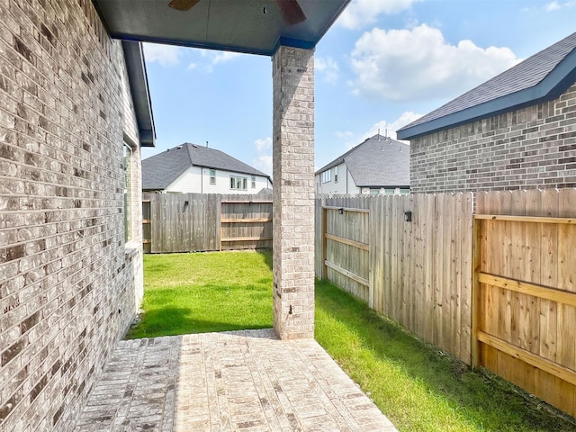 view of yard featuring a patio and a fenced backyard