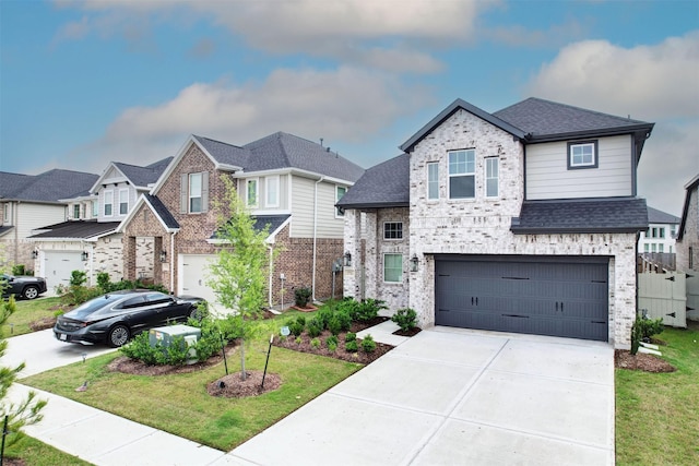 view of front of house featuring driveway, brick siding, a front lawn, an attached garage, and a shingled roof