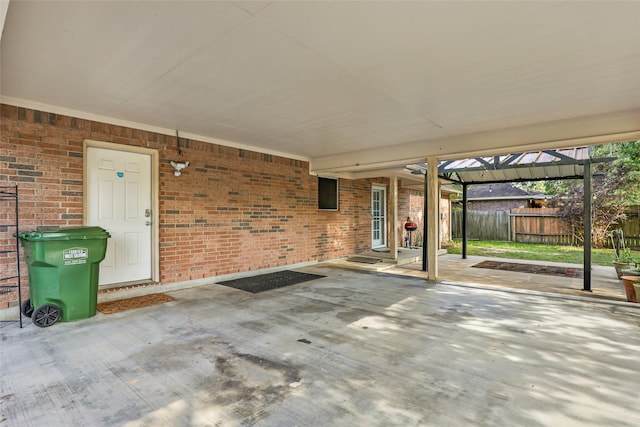 view of patio / terrace featuring fence