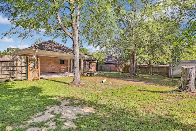 view of yard featuring a patio and a fenced backyard