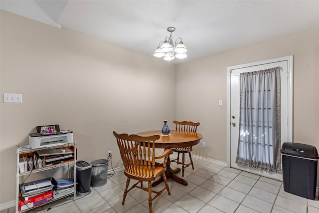 dining room with baseboards, light tile patterned flooring, and a notable chandelier