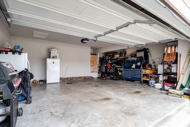 garage with freestanding refrigerator