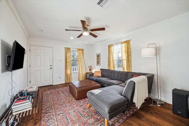 living room featuring ornamental molding, a ceiling fan, dark wood finished floors, and visible vents