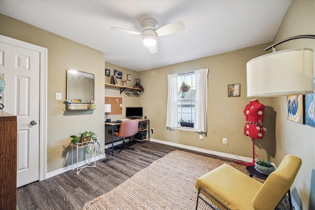 home office featuring baseboards, a ceiling fan, and wood finished floors