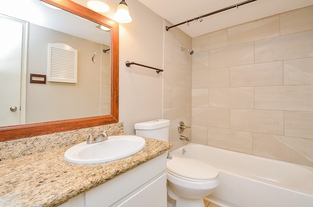 bathroom with vanity, washtub / shower combination, and toilet
