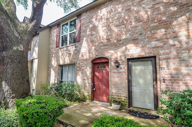 view of front of house with brick siding
