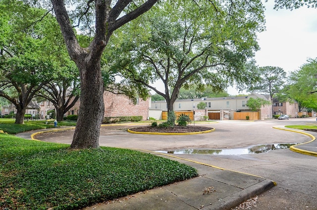 view of street with a residential view and curbs