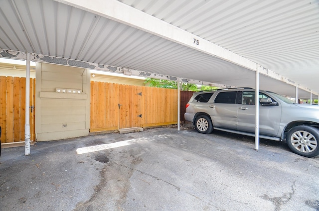 covered parking lot with fence
