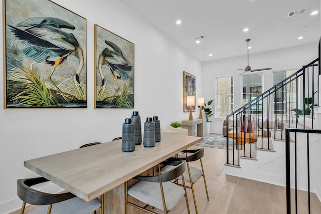 dining space featuring visible vents, stairway, recessed lighting, a ceiling fan, and light wood finished floors