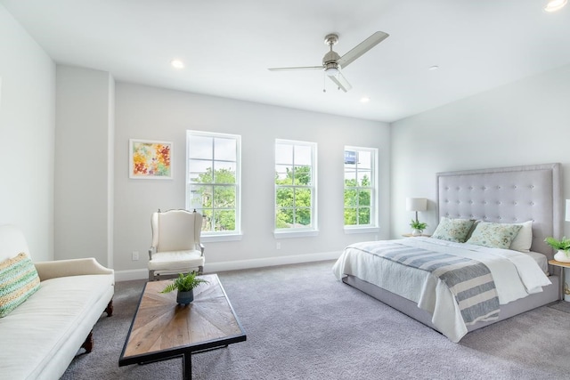 carpeted bedroom featuring baseboards, multiple windows, a ceiling fan, and recessed lighting