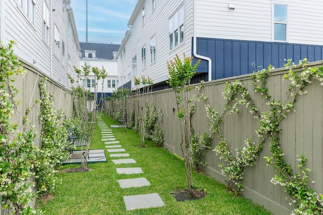 view of yard with a fenced backyard
