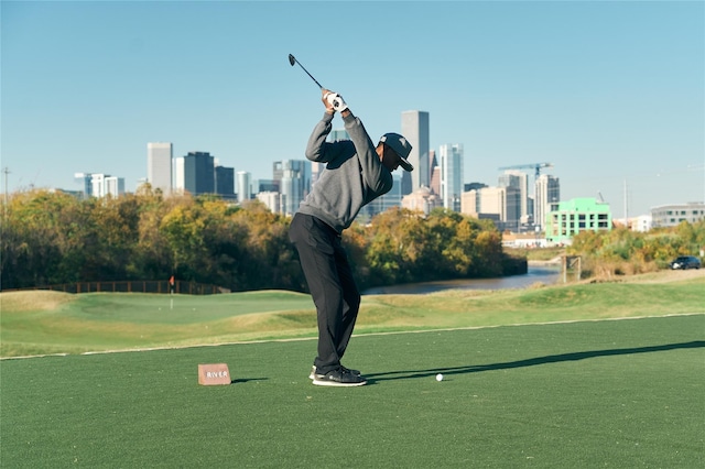 view of community with a view of city and golf course view