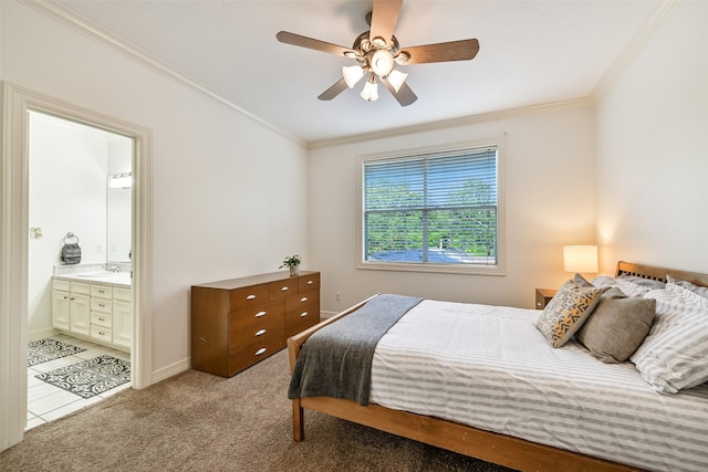 5217 Beech St, Bellaire, TX 77401 - bedroom featuring ceiling fan, a sink, ornamental molding, light carpet, and ensuite bath
