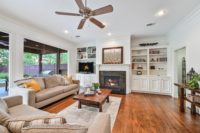 5217 Beech St, Bellaire, TX 77401 - living room featuring crown molding, ceiling fan, a fireplace, visible vents, and dark wood-style floors