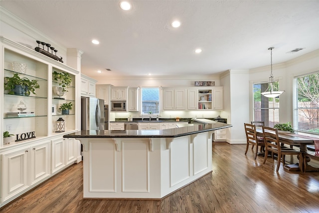 5217 Beech St, Bellaire, TX 77401 - kitchen with crown molding, open shelves, dark wood-type flooring, decorative light fixtures, and stainless steel appliances