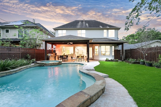 5217 Beech St, Bellaire, TX 77401 - rear view of property with stucco siding, a fenced backyard, a ceiling fan, a patio, and a yard