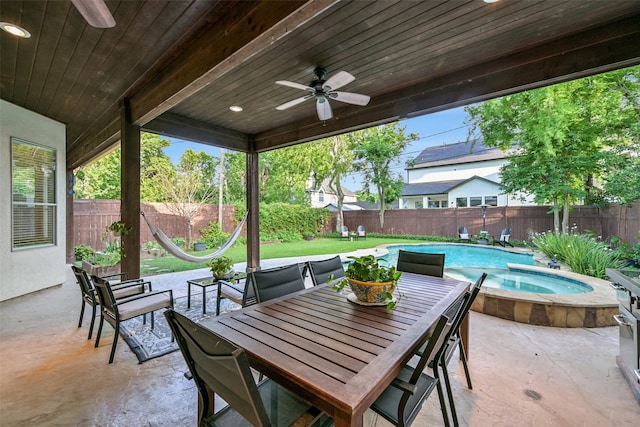 5217 Beech St, Bellaire, TX 77401 - view of patio with ceiling fan, outdoor dining area, a fenced backyard, a fenced in pool, and an in ground hot tub