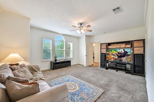 5217 Beech St, Bellaire, TX 77401 - carpeted living area featuring visible vents, ornamental molding, baseboards, and a ceiling fan