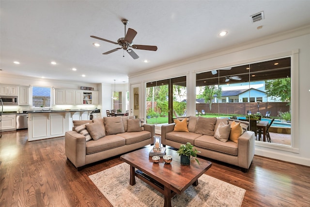 5217 Beech St, Bellaire, TX 77401 - living room featuring visible vents, ornamental molding, dark wood finished floors, and a ceiling fan