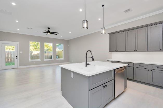 kitchen featuring stainless steel dishwasher, ceiling fan, a sink, and gray cabinets