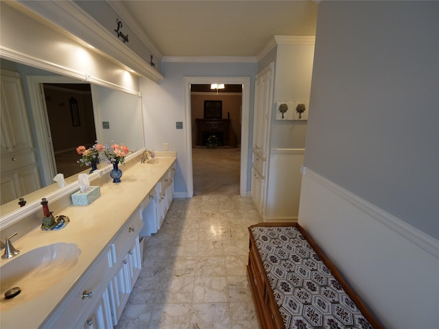 4202 Astwood Ct, Houston, TX 77068 - bathroom with double vanity, a sink, marble finish floor, and crown molding